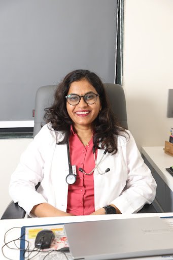 Client at consultation desk at Yuga's Aesthetic Clinic