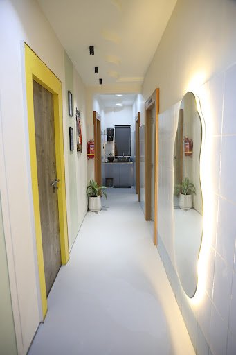 Treatment room signage at Yuga's Aesthetic Clinic