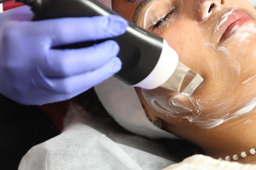Facial skin treatment performed in the clinic treatment room