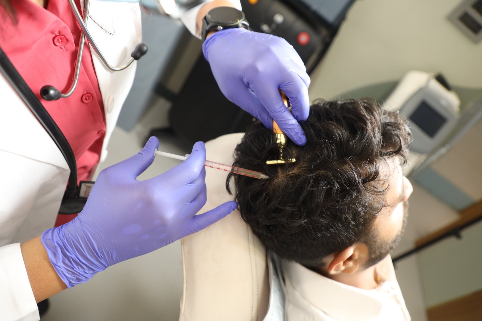 PRP hair treatment administered to the scalp by a clinician